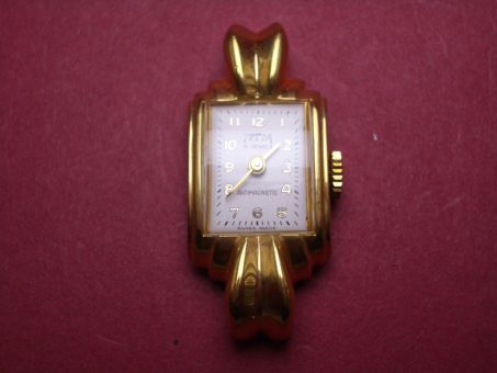 Komplette Uhr von Telda, Messing, vergoldet, 15,8mm x 36,1mm, weißes Zifferblatt mit goldfarbenen Ziffern, Gehäuseboden aus Stahl 
